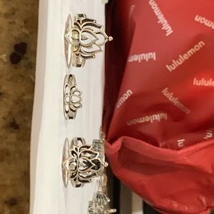 3 flower themed silver rings